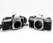 Fotocamere Nikon e Canon affiancate per un confronto tra sistemi fotografici